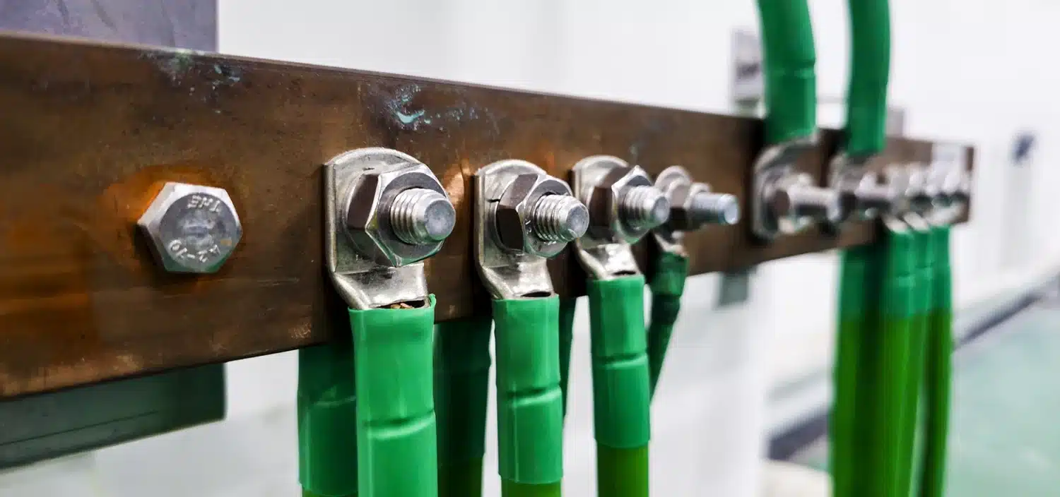 Engineer checking industrial pressure gauges in a facility