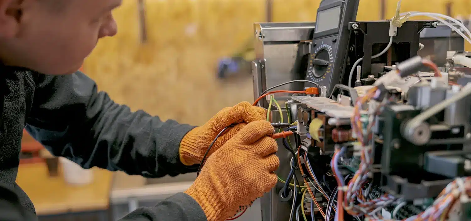 Engineer checking industrial pressure gauges in a facility