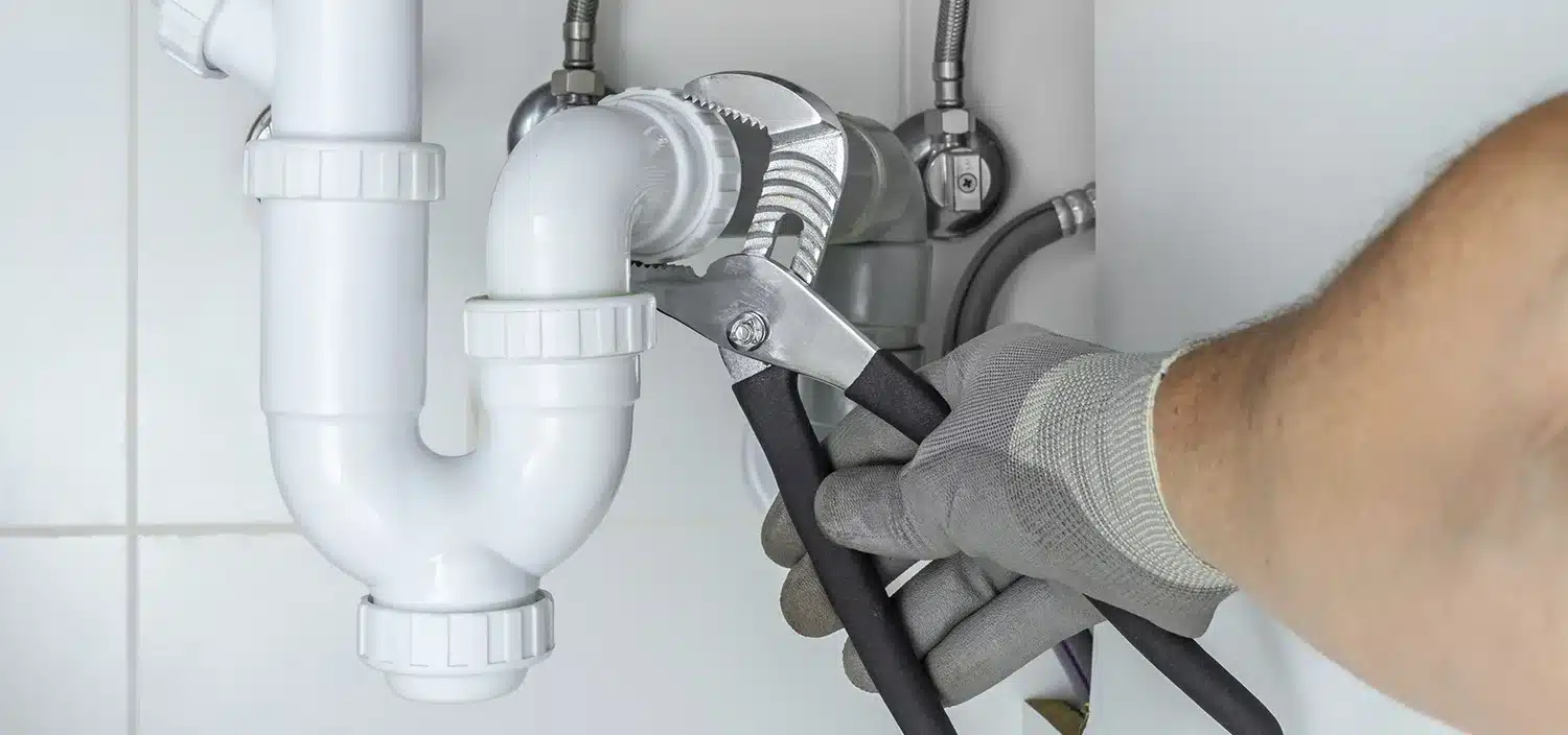 Technician repairing industrial machinery for maintenance work